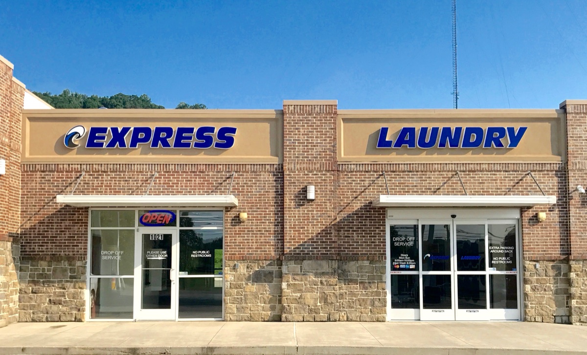 The Express Laundry Center storefront at 1021 Heiskell Ave, Knoxville — brick building with the blue EXPRESS LAUNDRY sign and drop-off service doors