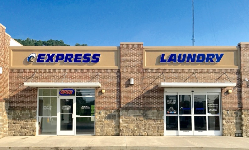 The Express Laundry Center storefront at 1021 Heiskell Ave in Knoxville, with the blue EXPRESS LAUNDRY sign above the entrance